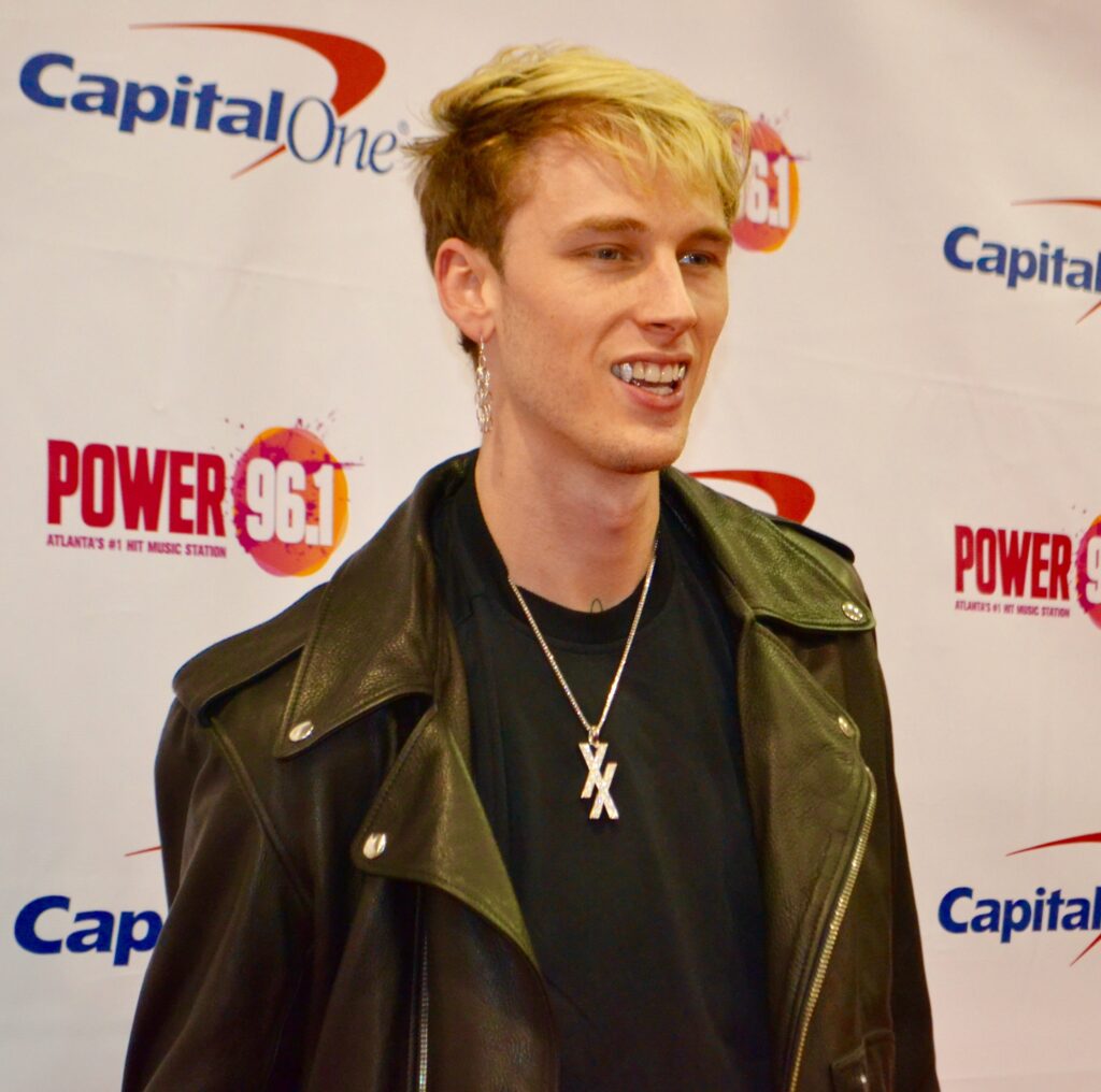 Machine Gun Kelly flashes a smile on the red carpet